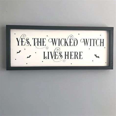 A wickeed witch lives here sign